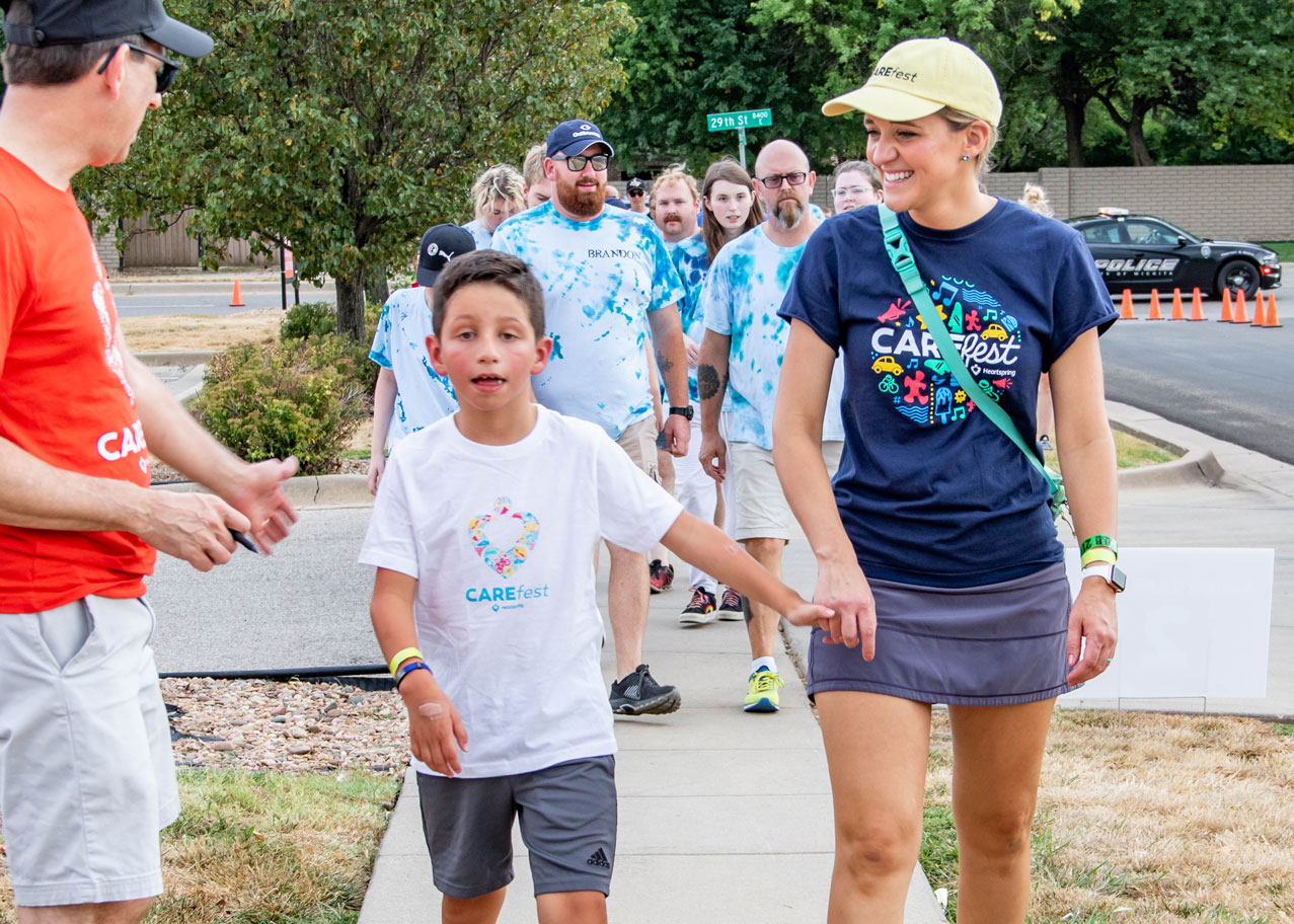 CAREWalk Girl with Autism Awareness Sign